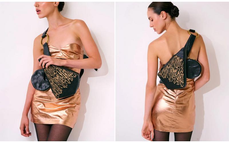 תיק עור מעצבת אורית לבנת בצורת משולש המשלב בד ועור