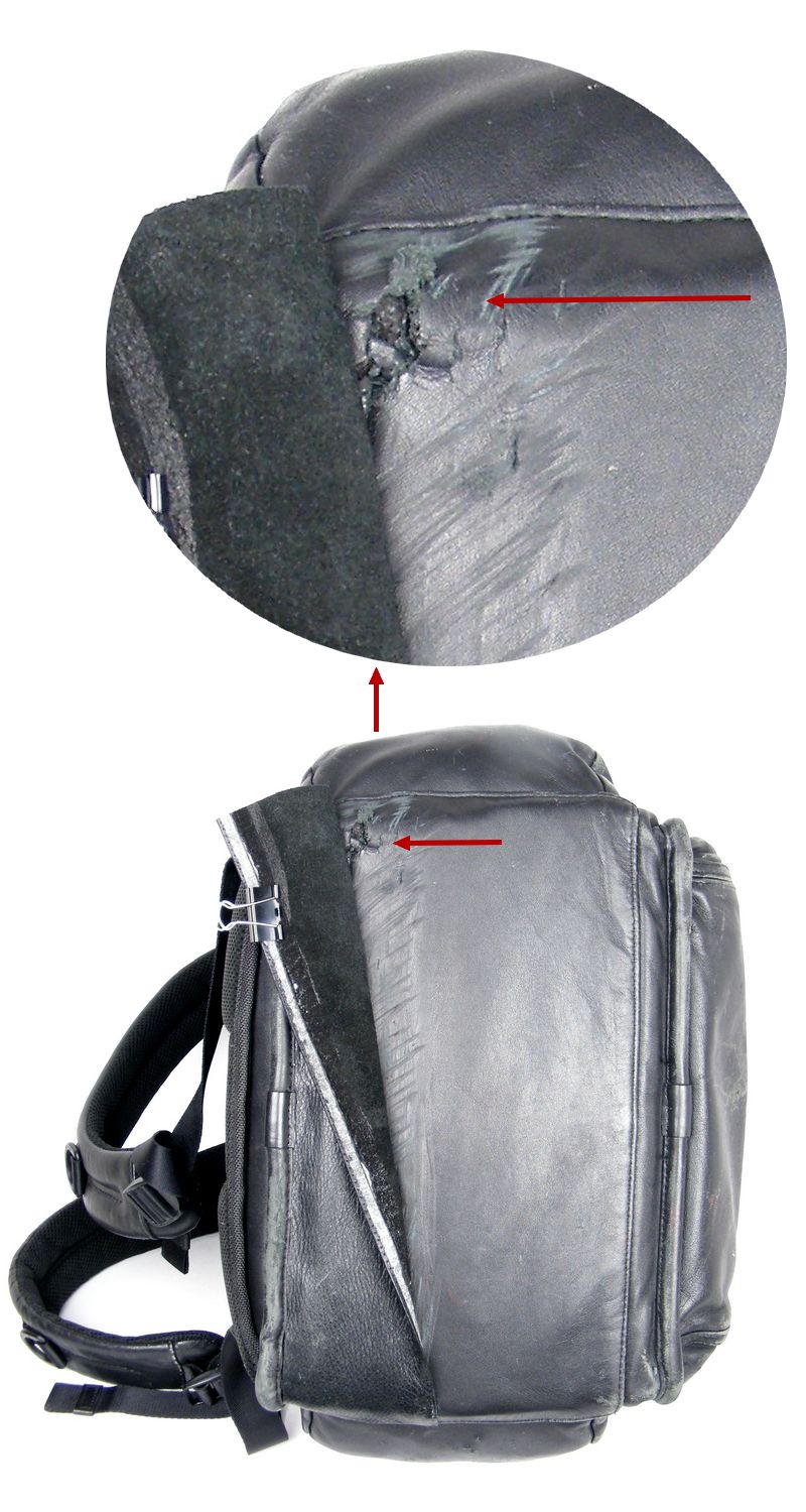 תקריב נזק בתחתית תיק TUMI קילוף עמוק וקרע (ממש חור) לפני טיפול