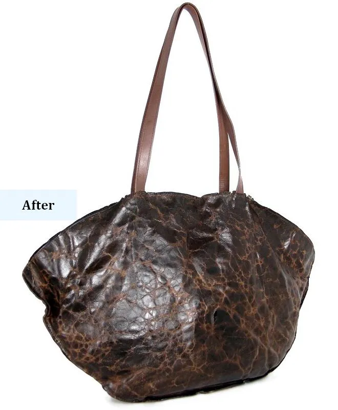 leather-bag-after-restoration-side-angle-mishi תיק עור לאחר חידוש ושחזור מקצועי - מבט צד אלכסוני המדגיש החייאת העור והמרקם הייחודי