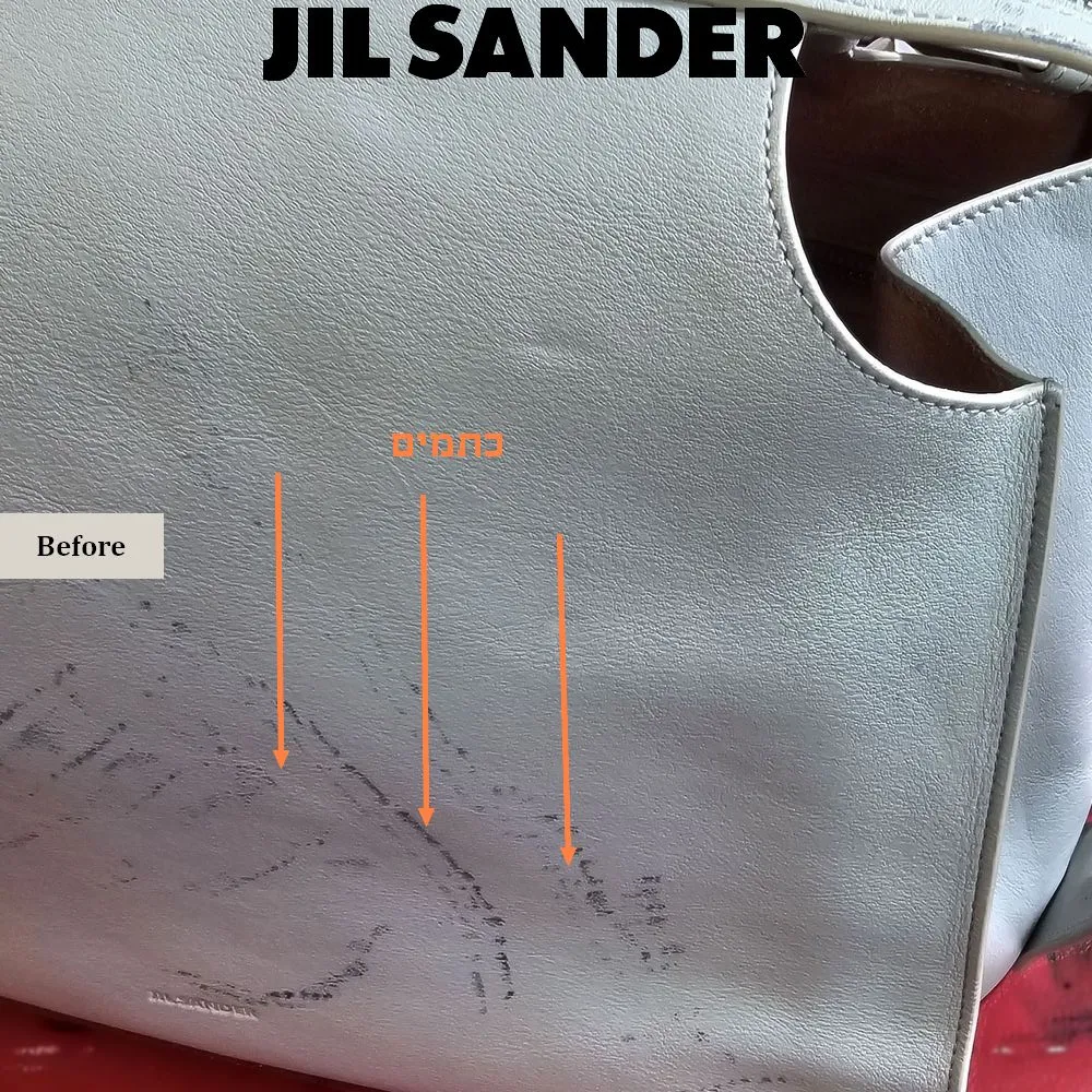 כתמים כהים על עור תיק Jil Sander לפני תהליך שיקום ושינוי צבע מקצועי